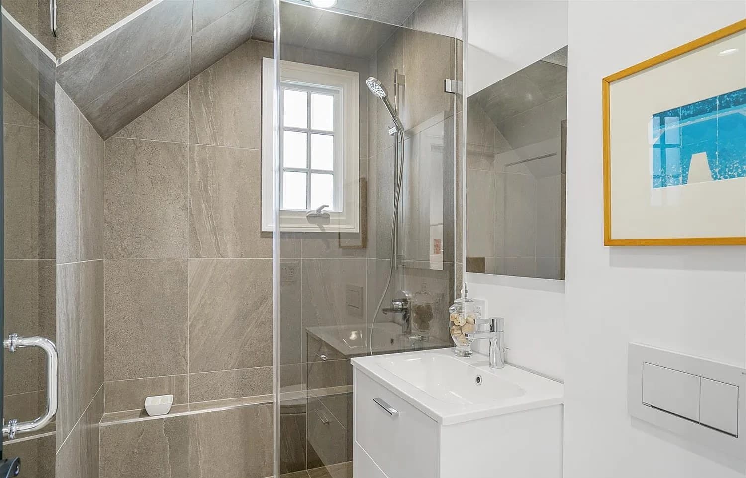 Upper-floor bath built into the roofline